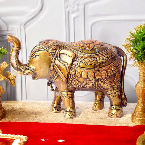 4.7 Inch Brass Elephant Statue with Upward Trunk: A Symbol of Prosperity and Good Luck. This Exquisite Brass Figurine Features an Elephant with Its Trunk Raised, A Traditional Sign of Abundance, Strength, and Positive Energy. Perfect for Enhancing Home Décor, Office Spaces, or Temple Altars, Bringing Blessings of Success and Harmony. India’s Largest Pooja Accessories Brand – www.satvikworld.com