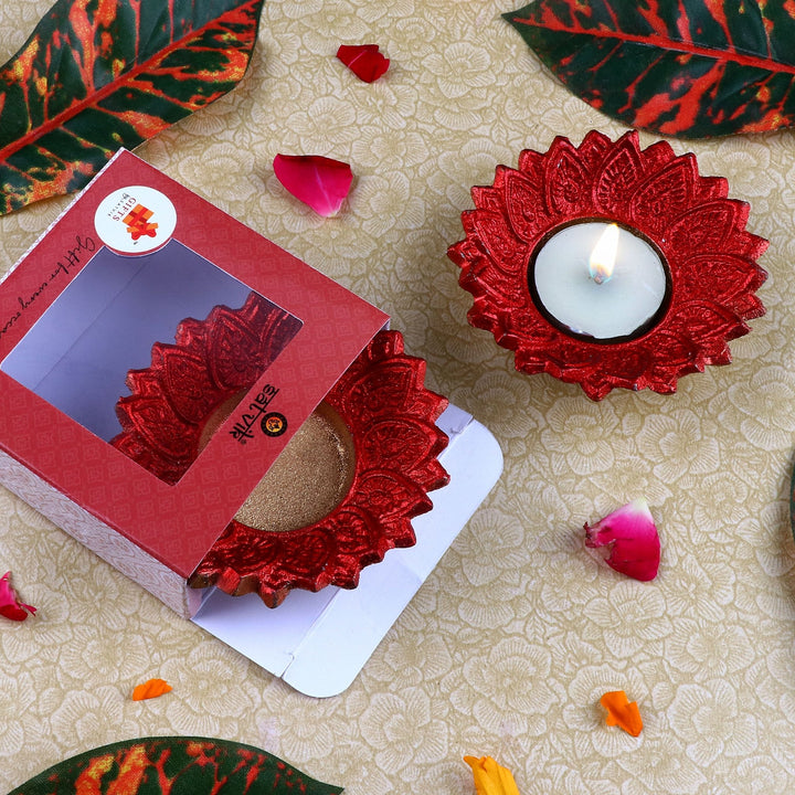Pack of 2 red Floral Chakra-shaped metal diyas with intricate petal design, perfect for Diwali, Pooja, and home temple décor. India’s Largest Pooja Accessories Brand – www.satvikworld.com