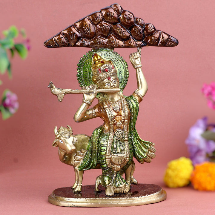 Brass Krishna Holding Mount Govardhan Idol, Depicting Lord Krishna’s Divine Act of Protecting His Devotees by Lifting the Mount. Handcrafted with Exquisite Detailing, Ideal for Temple, Pooja, and Home Décor. A Powerful Symbol of Divine Protection, Strength, and Love. India’s Largest Pooja Accessories Brand – www.satvikworld.com