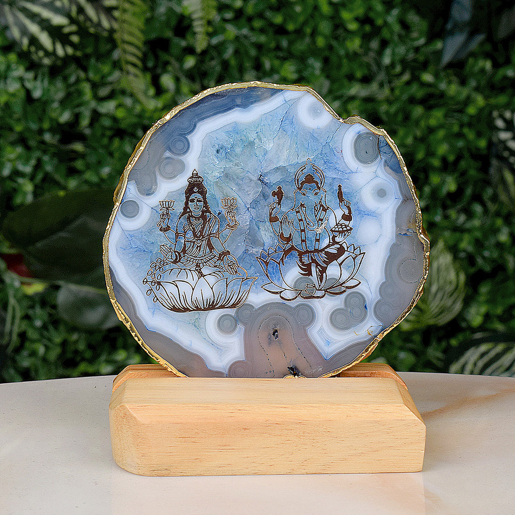 Agate Stone Stand featuring divine Laxmi and Ganesha artwork on a natural agate crystal base India’s Largest Pooja Accessories Brand – www.satvikworld.com