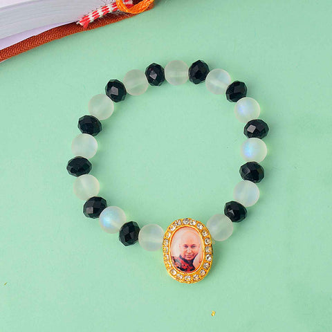 Guruji Swaroop Bracelet with elegant white and black beads – spiritual bracelet for pooja, gifting, satsangs, and daily wear. Satvikworld.com