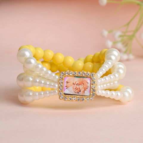 Pale Yellow with White Pearl Four Layer Guruji Swaroop Bracelet featuring soft pale yellow beads and radiant white pearls with Jai Guruji Swaroop – perfect for spiritual wear, festive gifting, and daily devotion. India’s Largest Pooja Accessories Brand – www.satvikworld.com