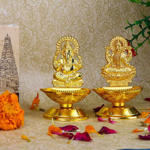 2 Pc Laxmi Ganesha Pair Metal Diya – A set of two elegant metal diyas featuring Goddess Lakshmi and Lord Ganesha, ideal for home decoration and religious ceremonies, adding a touch of divinity and prosperity. India’s Largest Pooja Accessories Brand – www.satvikworld.com