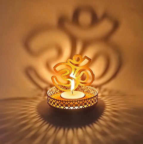 Handcrafted OM Shadow Diya made of durable metal, designed to project the sacred OM symbol when lit, ideal for spiritual ambiance and festive decor. India’s Largest Pooja Accessories Brand – www.satvikworld.com