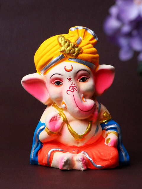 4.3-inch eco-friendly Bal Ganesha idol, vibrantly hand-painted in multiple colors, adorned with an orange pagdi, and seated in a serene Padmasana pose, crafted from biodegradable Shadu Mati clay. India’s Largest Pooja Accessories Brand – www.satvikworld.com